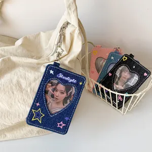 Close-up of Y2K denim star card holder with heart window and metal lobster clasp detail