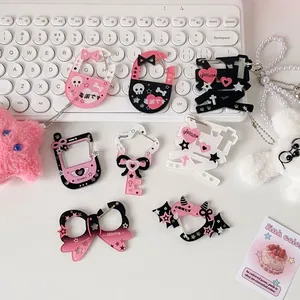 Y2K style acrylic heart and Japanese character charms with metal chains on white background