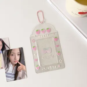 Macro detail of transparent glitter card holder featuring 3D strawberry and pink chain