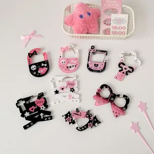 Pink and black acrylic carabiner charms in heart and lock shapes for plush doll bag décor