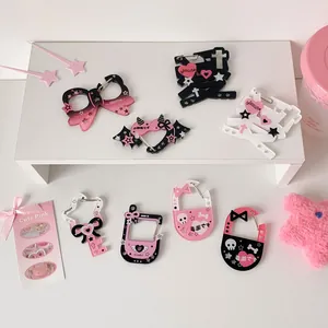 Detailed view of various acrylic charms in heart and star shapes for plush toys and bags