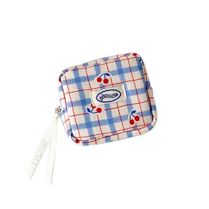 Blue plaid cherry storage bag with white ribbon and sweet Hisocute woven label