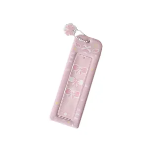 Pink photo card holder with white bow patterns and flower charm keychain for fans