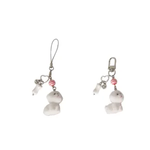 Cute white flocked puppy keychain with bone charm and pink bead on silver lobster clasp