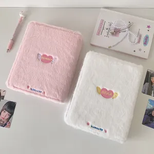 Detailed view of pink and white plush A5 photo albums with cute heart embroidery