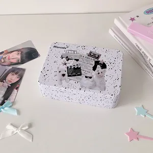Detail of vintage American style tin box with black splatter dots and retro collages