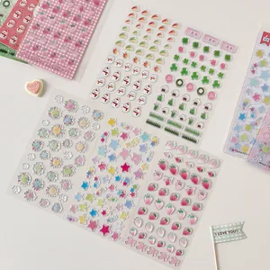 Close-up of 3D puffy resin stickers with cute strawberry and lucky clover patterns
