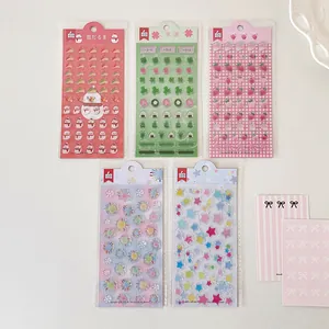 Five sets of cute strawberry and clover epoxy resin stickers in original packaging