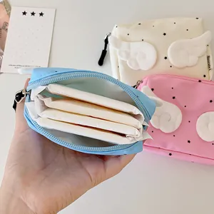 Detailed view of mini wings pouch showing inner capacity for sanitary pads and small items