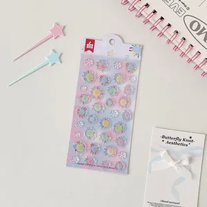 Close-up of cute 3D resin strawberry and clover stickers for DIY journal decor