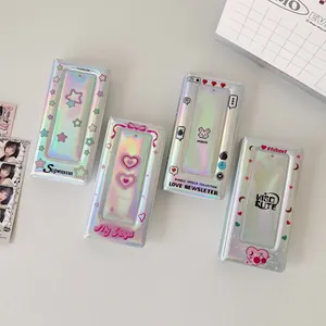 Detailed macro view of four holographic photocard albums with trendy K-pop style patterns