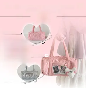 Close-up of quilted bow cross-body bag in pink white and silver with clear card slots