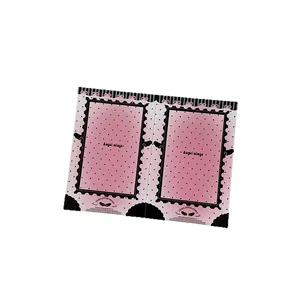 Pink and black Angel Wings polaroid film card holder with a decorative ribbon bow