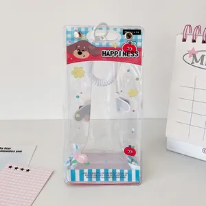Detail of transparent PVC doll storage bag featuring cartoon puppy and blue plaid patterns