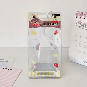 Detail of clear PVC doll display bag with metal snaps and cute cartoon pattern