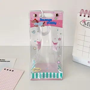 Clear PVC doll display pouch with pink Sausage Puppy header and white spiral lanyard