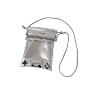 Silver metallic crossbody bag with retro game controller design and hisocute logo