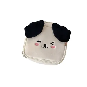 Cute cartoon plush cosmetic bag in cream white featuring dog embroidery and 3D ears
