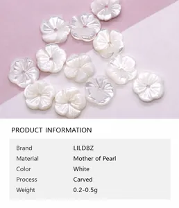 Detailed macro view of white carved tulip sea shell loose beads for DIY jewelry making