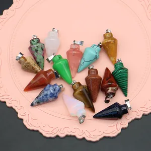 Collection of arrow-shaped natural stone pendants in various colors with silver bails