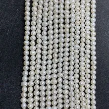 Detailed close-up of 3-5mm high-luster white freshwater pearl strands for DIY jewelry making