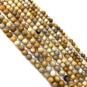 Natural coral jade beads in various sizes with unique floral patterns for jewelry making