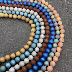 Macro view of multi-colored druzy agate beads with electroplated metallic finish