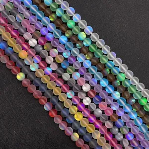 Macro detail of matte synthetic moonstone beads with vibrant aurora iridescent effects