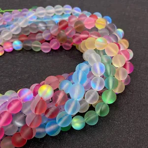 Macro shot of matte colorful aurora synthetic moonstone beads for DIY jewelry making