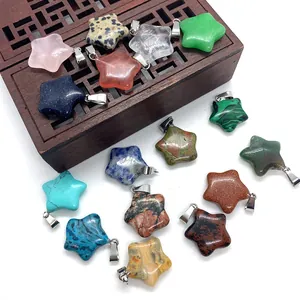 Macro detail of star-shaped natural stone pendants with silver metal bails on wood