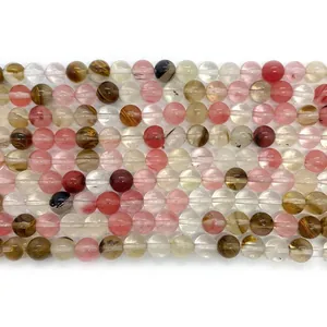 Polished 8mm natural watermelon crystal beads showing unique texture on white background