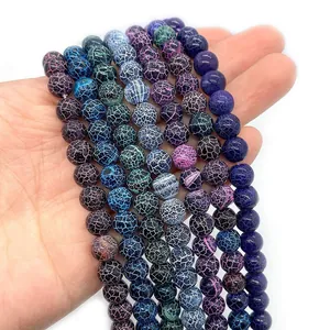 Drakenader agaat kralen in diverse kleuren voor DIY sieraden vastgehouden