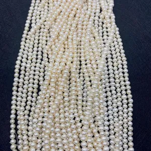 Macro detail of high-luster white freshwater pearls on a textured black background
