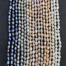 Macro view of assorted baroque freshwater pearls in blue, lavender, and white for DIY jewelry
