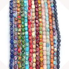 Detailed close-up of 2-3mm faceted crystal beads in various vibrant imperial jasper colors