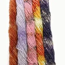 Detailed view of colorful 12-sided faceted tiger eye beads for DIY jewelry making