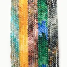 Macro shot of vertical natural gemstone bead strands in various vibrant colors for DIY