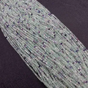 Macro shot of 2mm faceted green fluorite stone beads for jewelry making projects