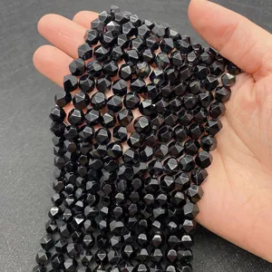 Macro detail of faceted black agate natural stone beads for DIY jewelry making