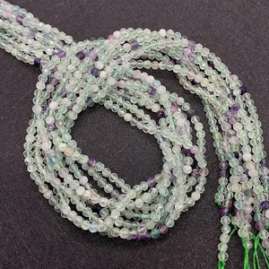 Macro shot of 2mm-4mm faceted natural green and purple fluorite beads for DIY jewelry