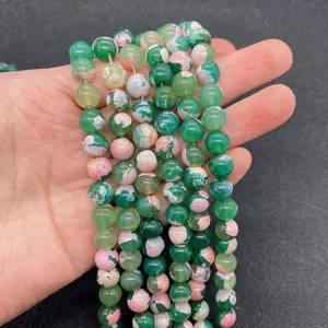 Macro detail of green and pink dragon vein agate beads for DIY jewelry making