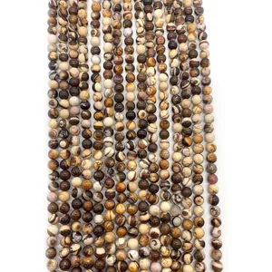Perles rondes en pierre zébrée naturelle d'Australie avec motifs paysagers brun sur fond blanc