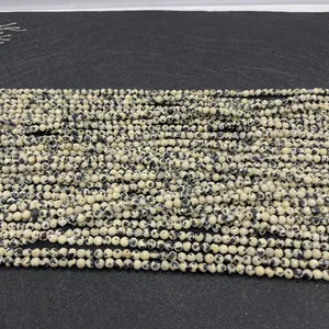 Close-up of faceted dalmatian jasper beads with natural spotted texture for DIY jewelry