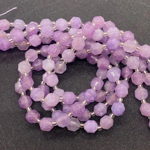 Close-up of faceted lavender amethyst beads with clear spacers for DIY jewelry
