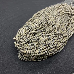 Detailed macro shot of faceted dalmatian jasper beads for DIY jewelry making