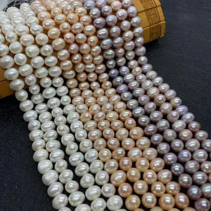 Macro detail of high-quality freshwater pearls in white, peach and lavender shades