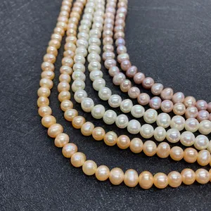 Macro detail of natural freshwater pearls in white, pink and orange with high luster