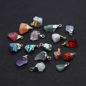 Detailed macro view of assorted natural semi-precious stone pendants with metal edges