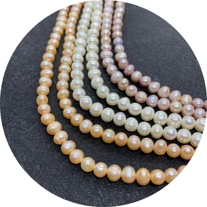 Natural freshwater pearl strands in white, lavender and champagne hues on black display