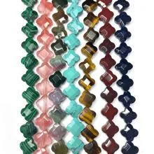 Macro view of multifaceted clover-shaped natural gemstone beads for jewelry making